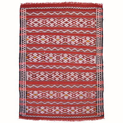 Handwoven Berber Zemmour Kilim rug with geometric patterns arranged in banded format interspersed by plain red stripes.