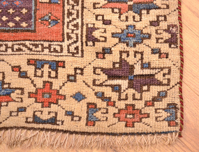 Antique Bergama rug border close-up with fringe along the bottom edge