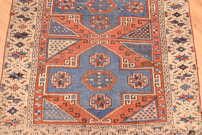 Antique Bergama rug center medallion close-up with geometric arrows and star motifs