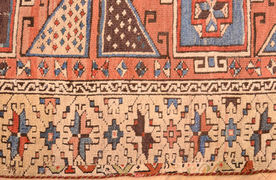 Antique Bergama rug lower border close-up with repeating motifs and fringe edge