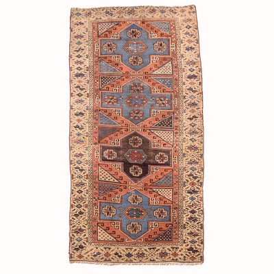Antique Bergama area rug with blue, rust, and beige geometric medallion center