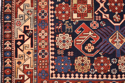 Antique Shirvan rug with red, blue, and cream geometric motifs border
