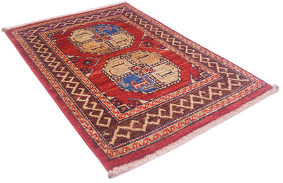 A rectangular hand-woven Afghan Fil Pai Mat with a traditional geometric pattern, featuring a red field, dark brown borders, and beige central panels with blue accents, shown on a plain white background.