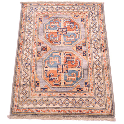 A rectangular small Afghan Fil Pai rug with a traditional geometric pattern, featuring two central octagonal medallions in blue and orange on a grey background with a beige border.