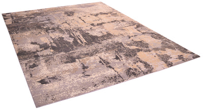 Angles view onf handkntted carpet with mid to ligth greys and mid to light browns pure wool pile with raised handcut silk areas for texture and visual luminosity.