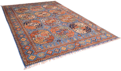 A traditional Afghan Ersari area rug with a complex geometric and floral pattern, featuring a blue border, orange and red central gul motifs, and cream fringe on a white background.