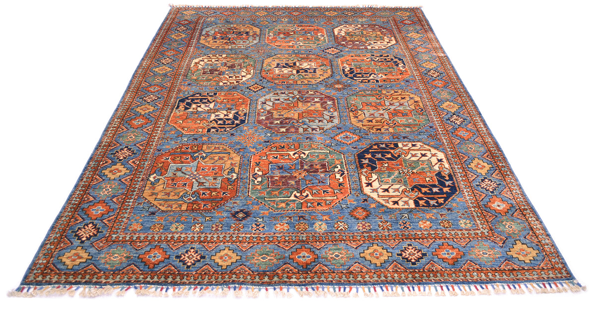 A traditional oriental Afghan handmade blue Ersari carpet with a blue field, featuring multiple central gul motifs and a detailed geometric border in orange, red, beige, and green, finished with white fringe on the ends.