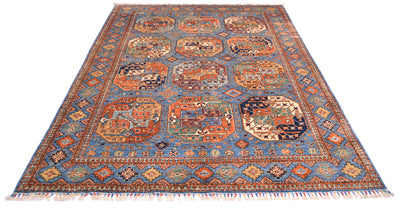 A traditional oriental Afghan handmade blue Ersari carpet with a blue field, featuring multiple central gul motifs and a detailed geometric border in orange, red, beige, and green, finished with white fringe on the ends.