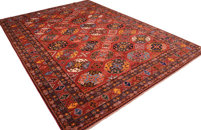 A 4x3m traditional large Afghan Ersari area rug with a complex geometric and floral pattern, featuring a dominant red field with intricate motifs in blue, yellow, black, and white.