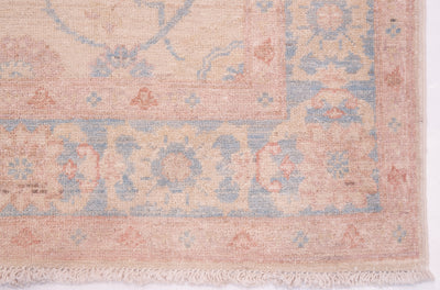 Detail of corner and border ofhandmade runner with pure wool pile and cotton warp fringe. Floral bordermain border and minor borders.