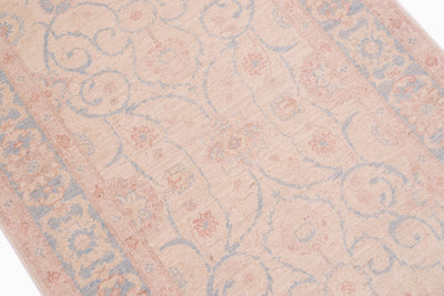 Close up detail of Afghan  Feraghan design runner with elegant soft palette with pure wool pile. Curling arabesque tendrils and floral blossoms fill main field. 