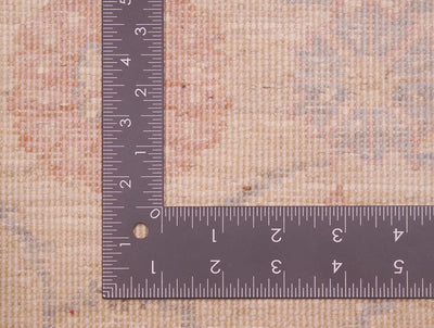 Reverse of runner rug showing handknotting and soft colour palette and fineness of weave. 