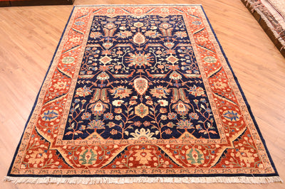 Fine Ferahan Carpet with dark blue background with contrasting floral pattern surrounded by a rust border with hints of blue, green and golden tones. Woven on a cotton foundation.