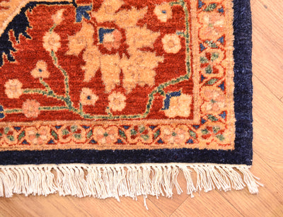 corner detail of fine Feraghan design carpet with rich tonalities and rust ambder border with ivory creams and midnight blue outer borders with cotton warps.