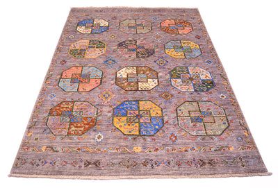 A square hand-woven Afghan modern Fil Pai area rug with a muted grey field, featuring a repeating pattern of multicoloured octagonal medallions and a detailed border.