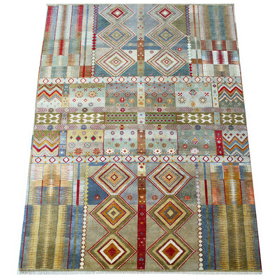 A 12x9 rectangular Large handmade luxury Gabbeh carpet  with a complex geometric design featuring geometric diamond, zigzag, and striped motifs in muted blue, beige, red, green, and brown tones.
