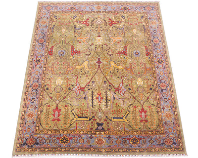 Overall view of handmade carpet with soft green field and blue background border. Cloudband traditional border with accents of gold yeloow, navy blue, red and light orange/ amber. 
