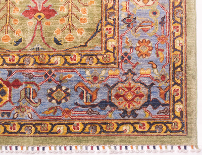 Corner detail of  handmade large Afghan carpet with colourfully bound cotton warp fringes.