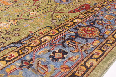 Detail of cloudband border of Garous style handmade carpet with sky blue background and dark navy blue and golden yellow detailing.