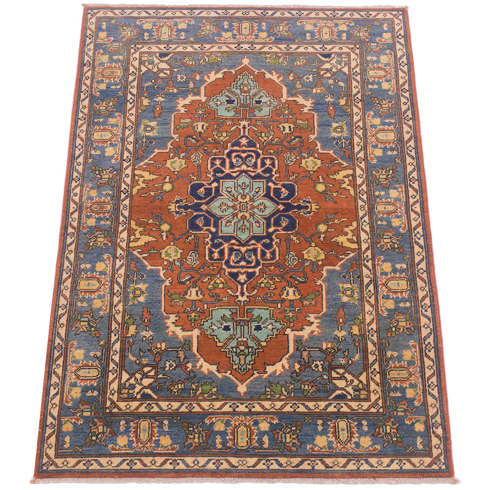 A traditional Afghan Handmade Heriz rug with a complex geometric and floral pattern, featuring a central medallion in rust red, blue, beige, and light green, surrounded by a blue field and patterned borders.