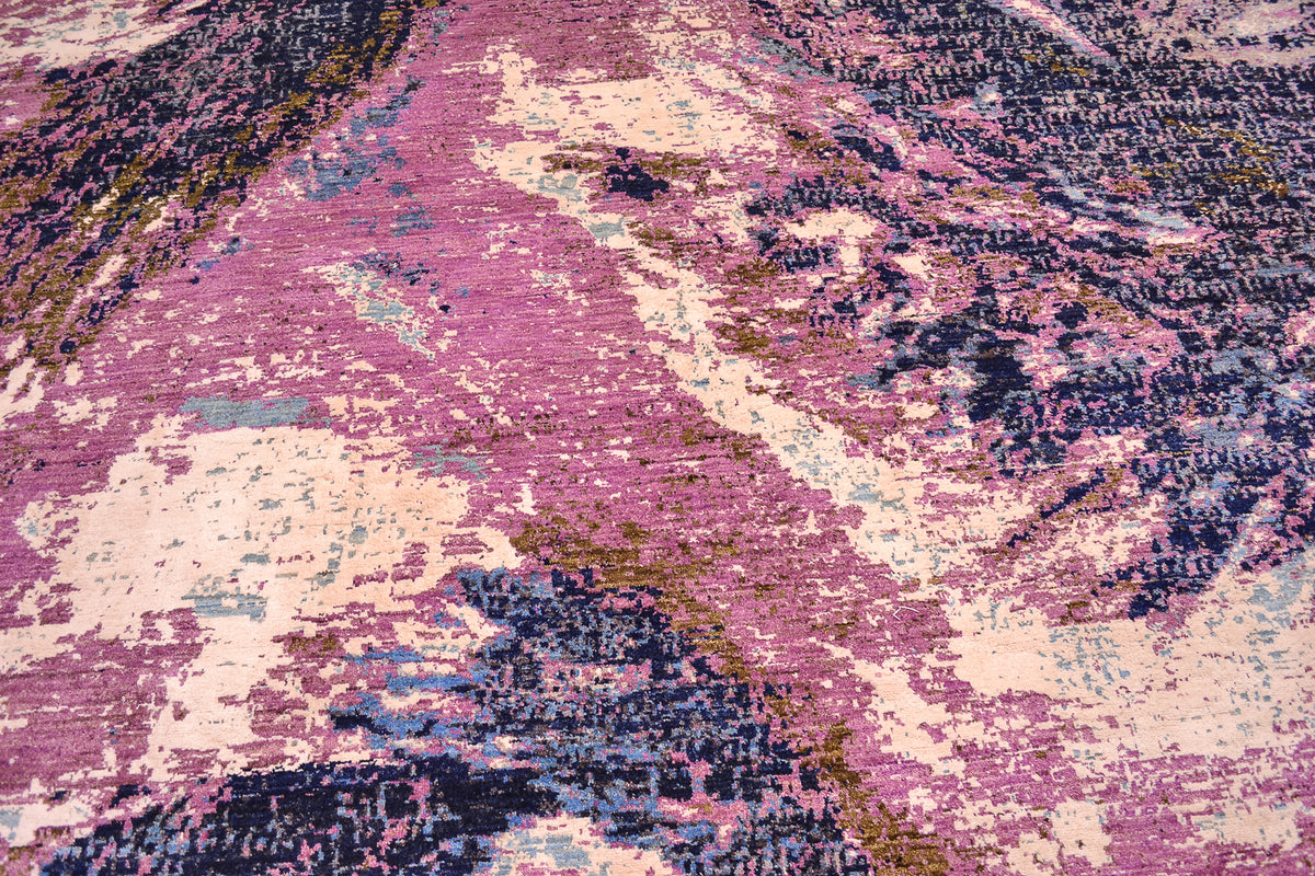  Close up design detail of hand-knotted abstract Himalaya carpet with mauvve, purple, dark blue, light blue, grey and creamy white of art viscose silk.