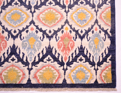 Corner detail  of ikat style carpet with pure wool pile woven on wool. Short cotton fringes ( warp threads)