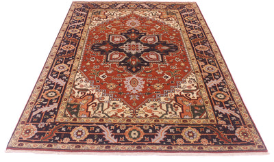 A traditional oriental Heriz area rug with an intricate floral and geometric pattern, featuring a prominent rust-red center medallion and dark navy borders, shown flat against a white background.