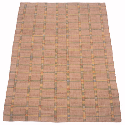 A rectangular woven area rug with a warm tan and beige base, featuring a subtle plaid pattern created by thin intersecting lines in muted yellow, green, and blue-gray.