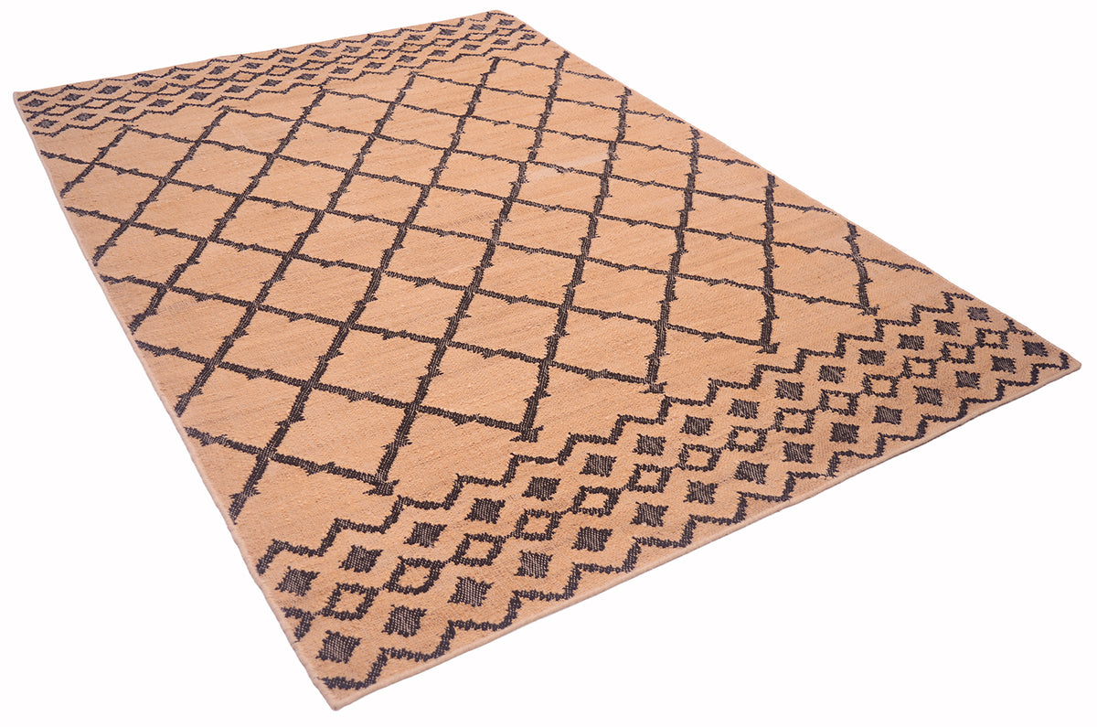 A rectangular area rug with a warm tan base and a dark brown geometric diamond lattice pattern, shown at an angle on a plain white background.