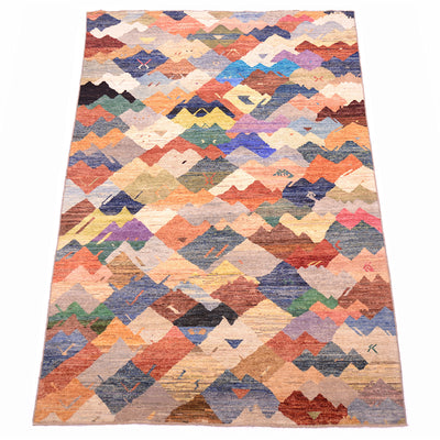 Multicoloured handwoven carpet with earthy, yet vibrant tones with abstract design with impression of overlapping natural forms with a variety of colours.