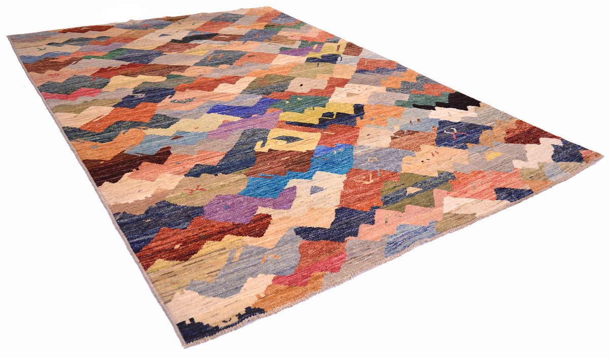 Angled view of  abstract modern carpet with a montage design and multicolured abstract natural forms with pure wool pile. All over abstract design.