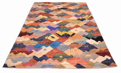 Over viiew of abstract coaretp handwoven in Afghanistan with array of earthy and vibrant colours with interlocking forms.