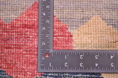 Back of handwoven carpet showing knots on the reverse of the carpet amd knots per square inch.