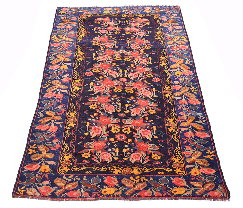 View of Karabagh gul farang design floral antique caucasian rug with mulitpl floral sprays and roses and leaves. Handknotted and woven on wool warps.