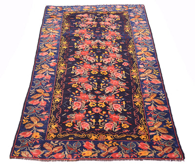 View of Karabagh gul farang design floral antique caucasian rug with mulitpl floral sprays and roses and leaves. Handknotted and woven on wool warps.