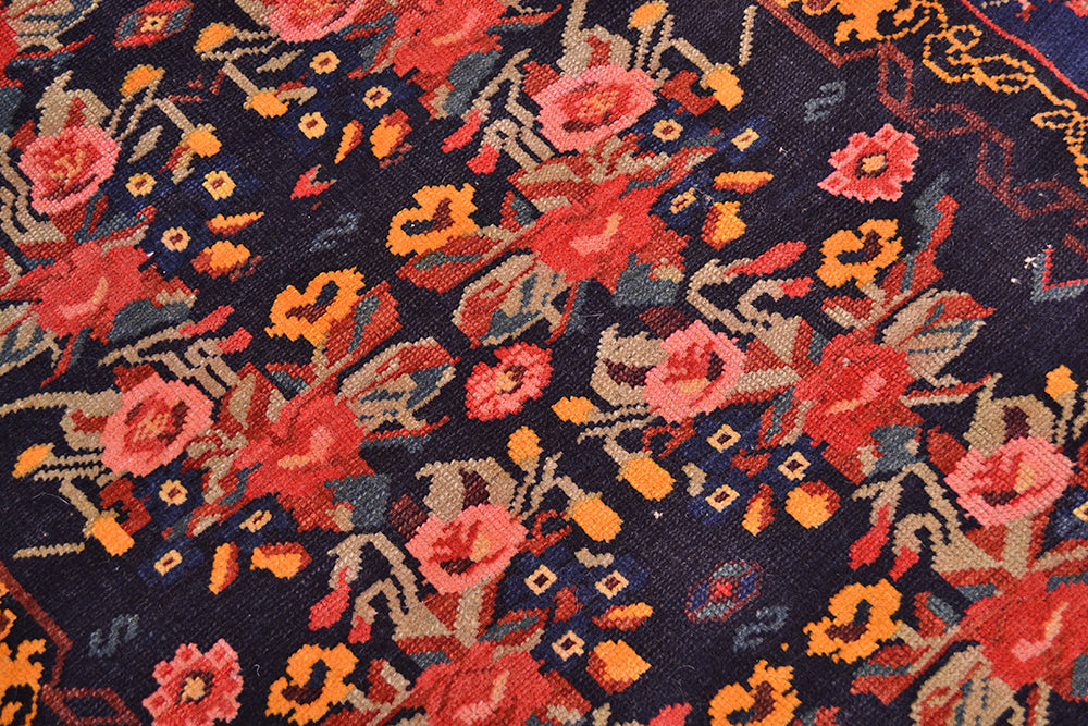 Details  of field of antique rug wirh wear commensurate with age .   Gul farang design with also small tribal decorative motifs.....angular and also curvilinear inner field design with chestnut brown and golden yellow ochre.