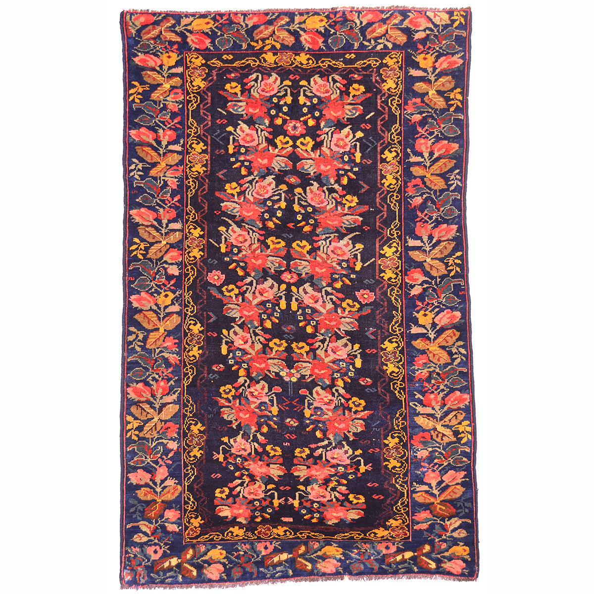 Antique Karabagh rug with floral design set against a blue-black ground deep indigo ground. Multipled floral spray in main field and border, scrolling vine inner border in golden ochre.