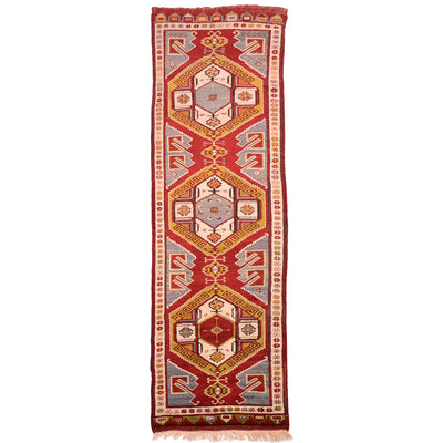 Old Karapinar runner with large scale geometric design on a red ground.