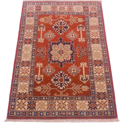 Handmade Kazak rug, rust-red center medallion with cream border, dark-blue accents, fringe
