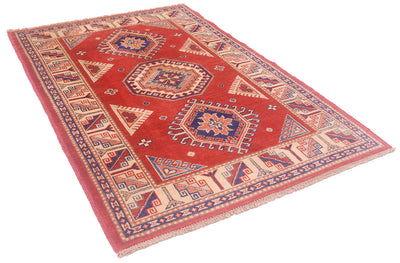 Red handmade Kazak rug laid flat with geometric motifs and decorative border