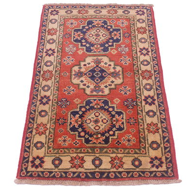 A traditional rectangular Kazak Mat with a red field, beige borders, and navy blue medallions, shown flat against a white background.
