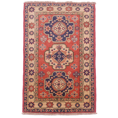 Small size handmade Kazak Matwith geometric design & terracotta primary colour along with navy and cream.