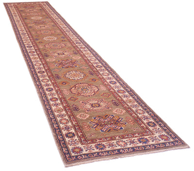 An extra long handmade Kazak runner rug with an intricate traditional pattern, featuring a beige center, red and blue floral motifs, and a dark border, shown on a plain white background.