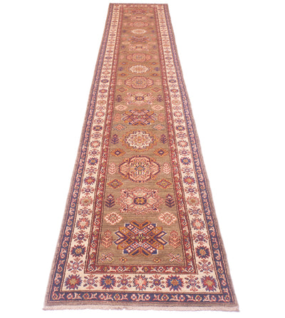 A long handmade Afghan runner with an intricate traditional pattern in beige, rust red, blue, and brown, shown flat against a white background.