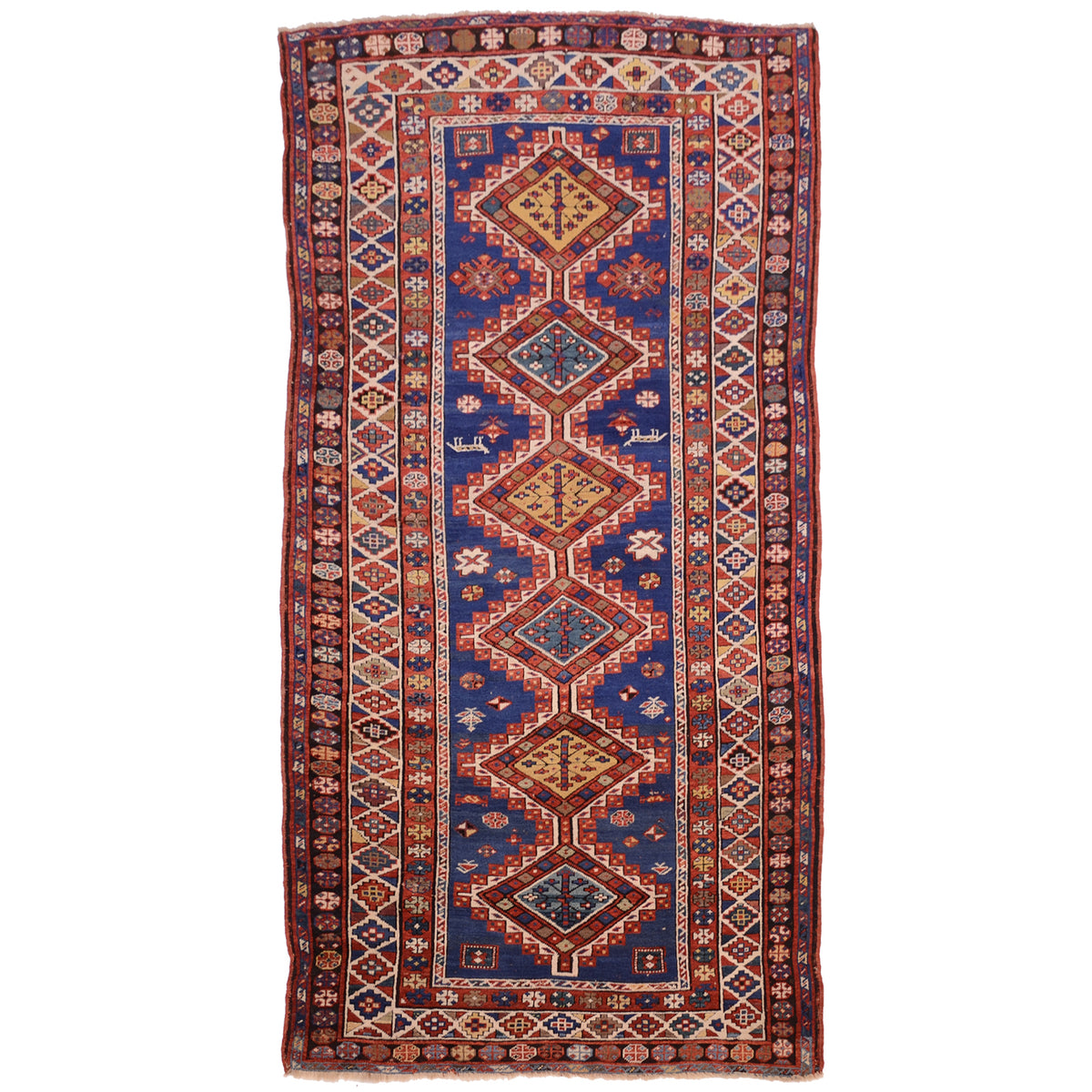 Antique Kazak long rug / runner with blue ground and 6 medallion design with a deep boue field and nunerous multiple geometric borders with rosettes and small stepped medallions. Motif filled field and stpped connecting medallions Colours of blue and red, gold, teal and black.