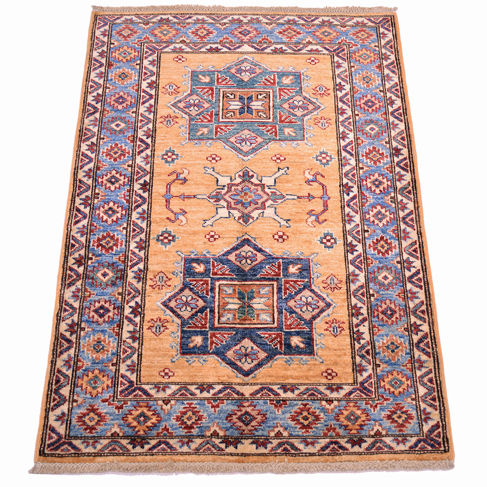 A 4x2'9 rectangular hand-woven small Fine Kazak Rug with a traditional geometric pattern, featuring an amber yellow centre field, blue and red medallions, and a light blue border, shown flat against a white background.