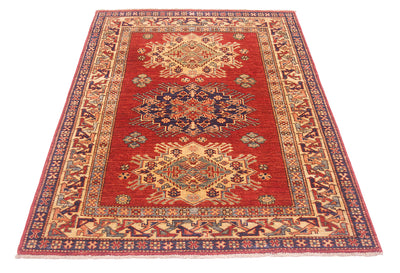 A rectangular traditional Afghan supreme Kazak rug with a red field, featuring two large central medallions and an ornate patterned border in beige, navy, and blue tones, shown on a plain white background.