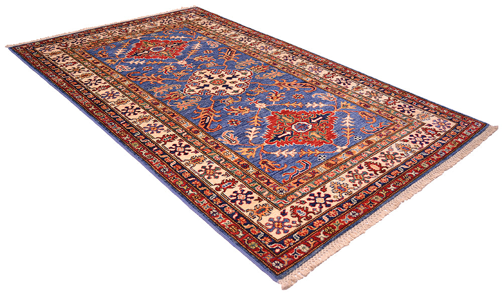 A rectangular area rug with a traditional Handmade Fine Kazak wool Rug , featuring a blue central field, red and beige floral motifs, and a patterned border, shown on a plain white background.