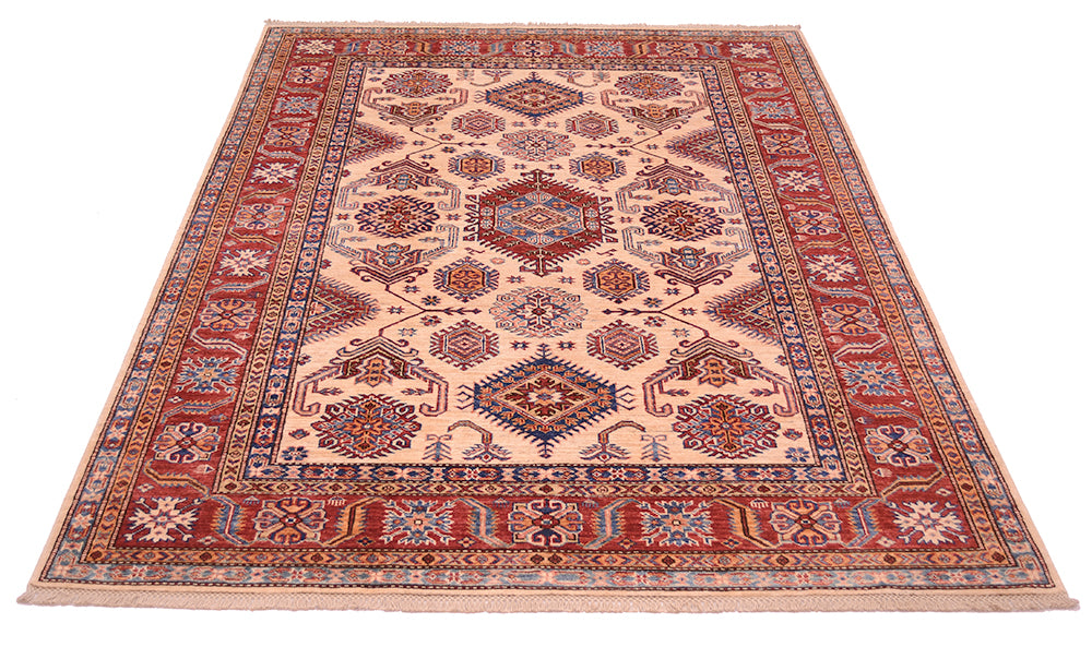 A traditional oriental Afghan Kazak handmade carpet with a beige centre field, red borders, and blue and orange geometric floral motifs, shown flat against a white background.