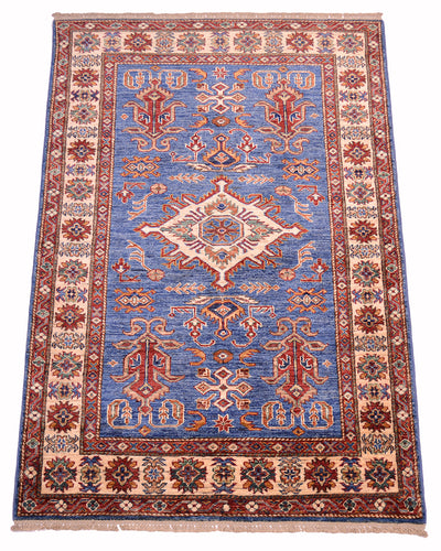 A traditional Handmade Fine Kazak Rug with blue field, beige and red borders, and a central medallion, shown flat against a white background.
